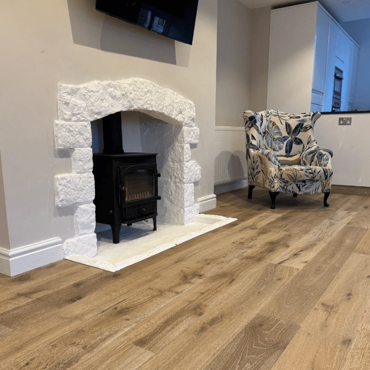 Lounge with fireplace after engineered oak floor installation