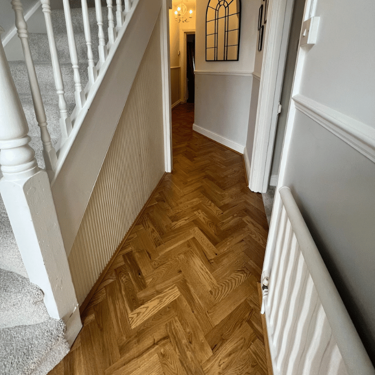Completed herringbone flooring around staircase